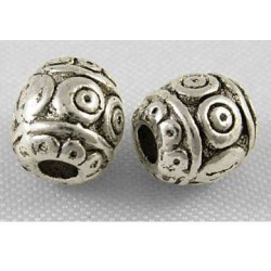 Perle de métal ovale décorée